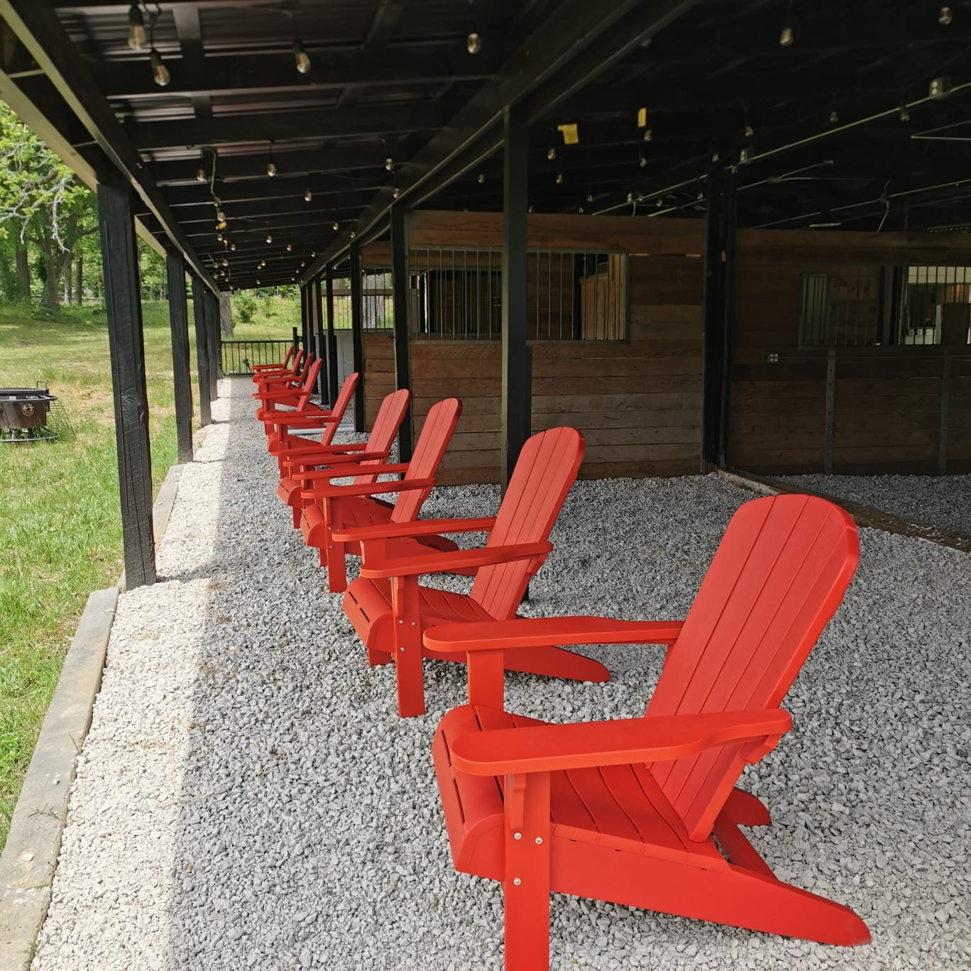 Red Chairs Lined Up at Rustic Event Center